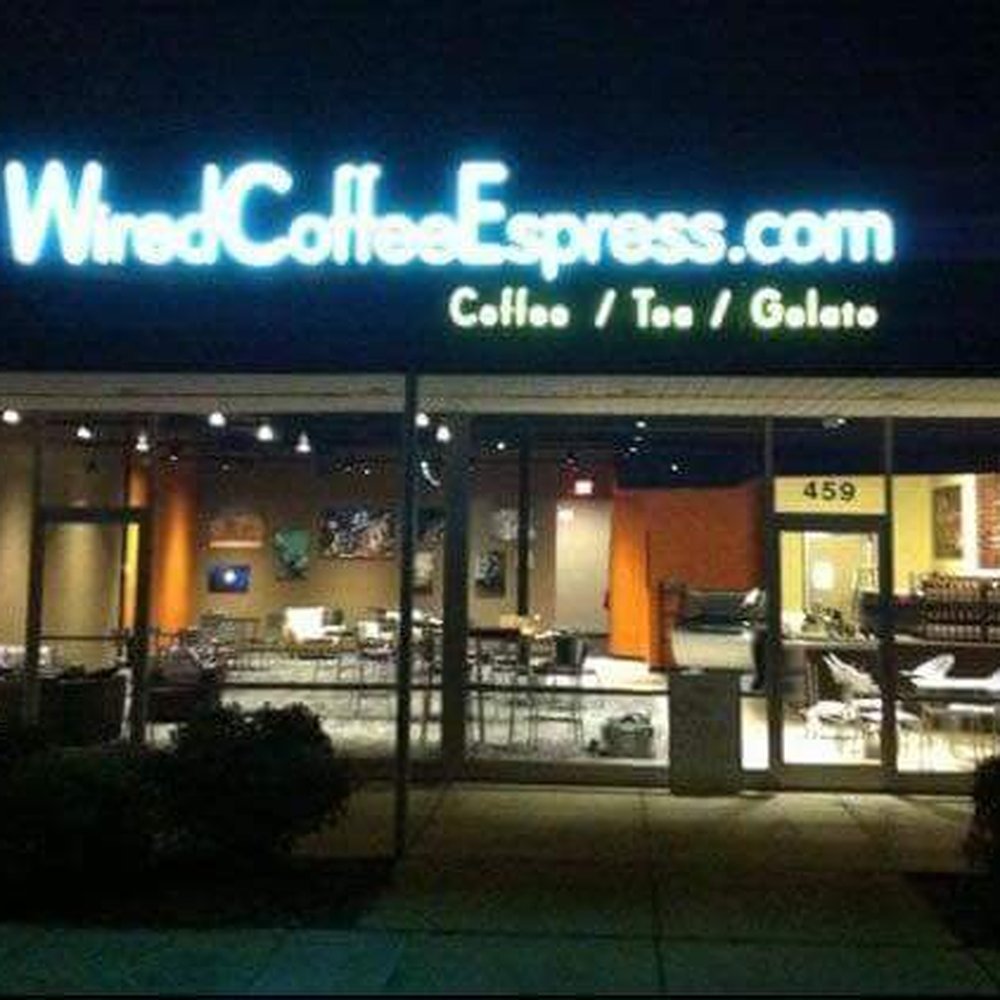 the entrance of a coffee shop the entrance of a coffee shop