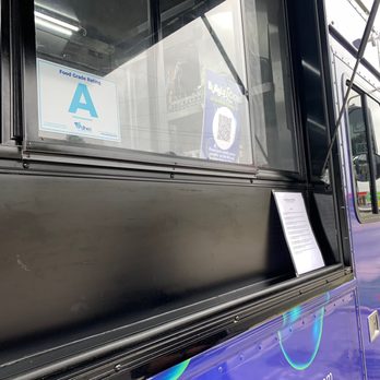 Bubblelicious By Elevation Catering - a woman looking out of a bus window - Food Trucks Near Me