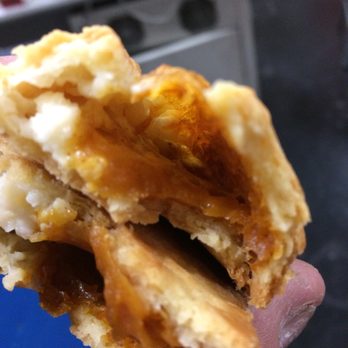 McDonald's - a hand holding a half eaten pastry - Fast Food Near Me - Albuquerque, New Mexico