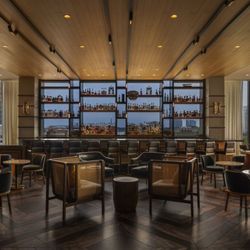 The Sleek Bar and Lounge Area at Tesserae. A perfect spot for pre-dinner cocktails, enjoying small plates, or socializing in ...