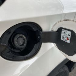 Amoco - Aw lawd. What kind of gas cap is this on my rental car?