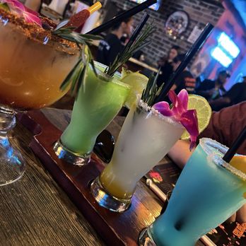 Dona Leti's - Margaritas flight. Mangonada with a side of their house made chamoy - Cocktail Bars Near Me - Houston, Texas Dona Leti's - Margaritas flight. Mangonada with a side of their house made chamoy - Cocktail Bars Near Me - Houston, Texas