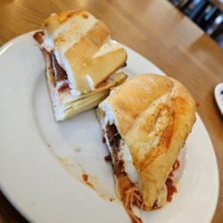 Marley G’s pizzeria - The chicken Parm sandwich, unevenly cut.