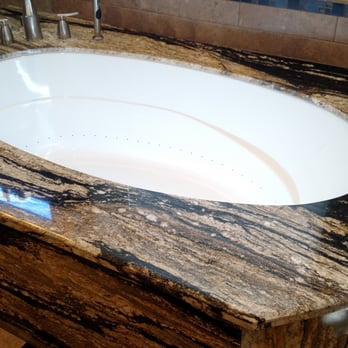 Granite Solutions - Jetted bathtub with granite surrounding it tub, granite, new plumbing and electrical done by Granite Solutions - General Contractors Near Me - Phoenix, Arizona