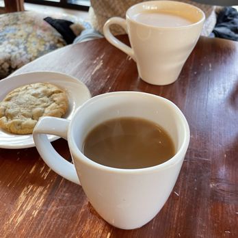 Home.Stead Bakery & Cafe - Back: chai latte. Middle: chocolate chip cookie. Front: earl grey tea with milk. - Coffee & Tea Near Me - Dorchester, Massachusetts