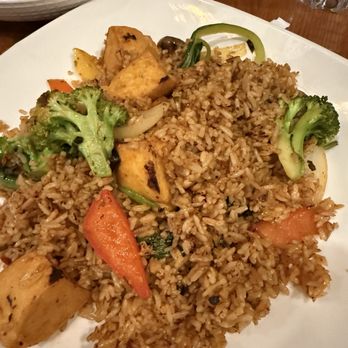Imm Thai - Fried rice with broccoli, carrots, and tofu served on a white plate at Imm Thai in Clark, NJ. - Thai Near Me - Clark, New Jersey