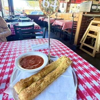 Gianni's Pizza - If you are eating in you MUST start with hot, fresh breadsticks & sauce! The best!! - Italian Near Me - Monterey, California Gianni's Pizza - If you are eating in you MUST start with hot, fresh breadsticks & sauce! The best!! - Italian Near Me - Monterey, California