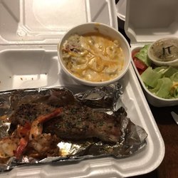 Boardwalk Cafe - Steak and shrimp with twice baked potato and salad