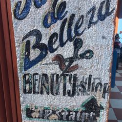 Virgilio Beauty Salon - Sign at bottom of stairs