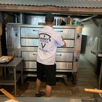 Manny's Pizzeria - Mark at the oven. - Pizza Near Me - Palm Coast, Florida Manny's Pizzeria - Mark at the oven. - Pizza Near Me - Palm Coast, Florida