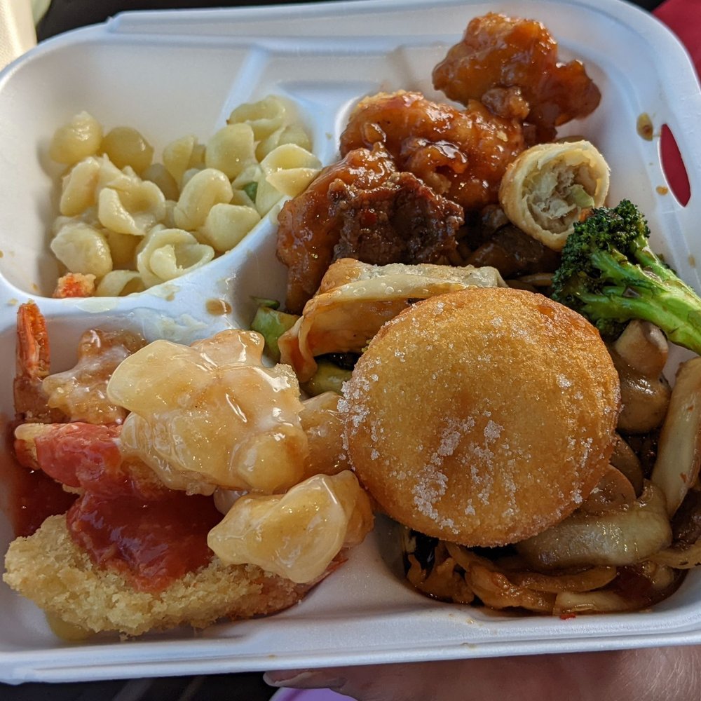 Ichiban Buffet - a hand holding a take out container of food - Shanghainese Near Me - Springfield, Missouri Ichiban Buffet - a hand holding a take out container of food - Shanghainese Near Me - Springfield, Missouri