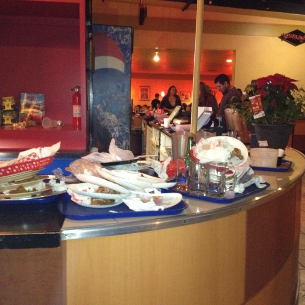 Shakey's Pizza Parlor - Disgusting! Yes, that is a pile of dirty dishes and trash between the register and the ticket redemption counter. GHETTO! - Pizza Near Me - Chino, California