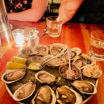 EDNA Restaurant - a plate of oysters on a wooden table - Canadian (New) Near Me - Halifax, Nova Scotia EDNA Restaurant - a plate of oysters on a wooden table - Canadian (New) Near Me - Halifax, Nova Scotia