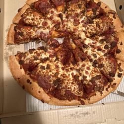 Pizza Hut - Pizza that is clearly missing a slice. This was how we opened it up