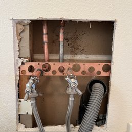 Before repairing, my laundry room wall had a gaping hole.