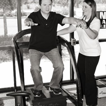 Heath Chiropractic & Acupuncture - Assisting patient with therapy - Chiropractors Near Me - Parker, Colorado Heath Chiropractic & Acupuncture - Assisting patient with therapy - Chiropractors Near Me - Parker, Colorado