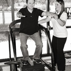 Heath Chiropractic & Acupuncture - Assisting patient with therapy