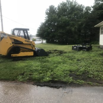 Rain Man Services - a bulldozer in a yard - Lawn Services Near Me - Zeeland, Michigan Rain Man Services - a bulldozer in a yard - Lawn Services Near Me - Zeeland, Michigan