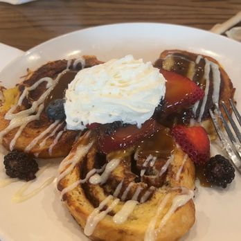 Another Broken Egg Cafe - Cinnamon Roll French Toast Brunch with Strawberries & Blueberries... topped with Whip Cream & a rum sauce... - Breakfast & Brunch Near Me - Morrisville, North Carolina