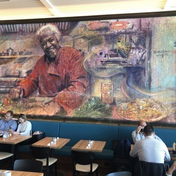 Leah's Kitchen - a mural of a man sitting at a table - Southern Near Me - Kenner, Louisiana