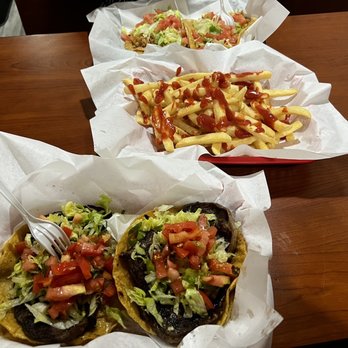 Raymond's Hamburgers and Tacos - (T): Chicken Taco. (M): French fries. (B): Rib Eye Taco - Burgers Near Me - Chicago, Illinois Raymond's Hamburgers and Tacos - (T): Chicken Taco. (M): French fries. (B): Rib Eye Taco - Burgers Near Me - Chicago, Illinois
