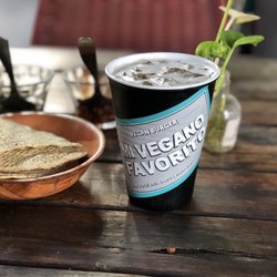Mi Vegano Favorito - Crisp tortilla chips, herb infused oil, chili oil, and agua fresca.
