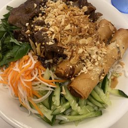 Vermicelli with barbecue pork and spring rolls.