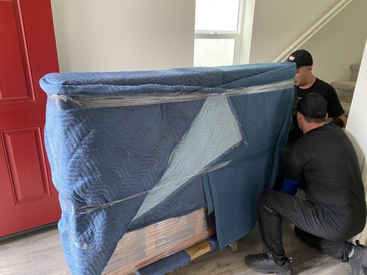 Professional Furniture Protection - We protect furniture with padded moving blankets, stretch wrap, and careful handling before loading. Our goal is to keep upholstery, wood surfaces, corners, and household items secure from pickup through delivery.