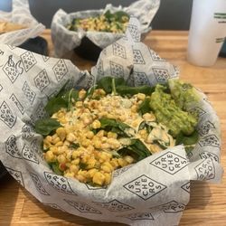 Surcheros Fresh Mex - Chicken burrito bowl topped with corn salsa, Surcheros sauce and guacamole.