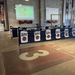 The Erie Social Shuffleboard Club & Bar - Courts, beer pong, and cornhole area.
