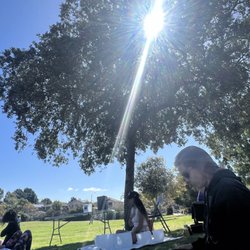 Leading a meditation before a sound bath in a park