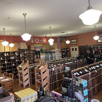 Cigar Exchange International - a man in a wine shop - Tobacco Shops Near Me - Upland, California