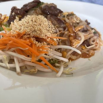 Thai Spoon - a plate of noodles with meat and vegetables - Thai Near Me - Durham, North Carolina