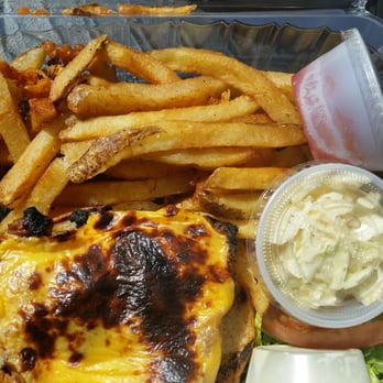 Captain Jake's - Burnt cheese on my Atlantic cod sandwich takeout order.  What a surprise! - Seafood Near Me - Newburgh, New York