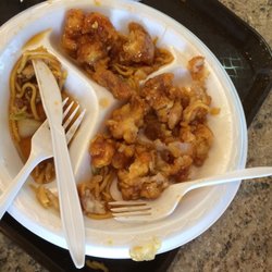 Wok & Roll - Plate full of General Tsaos chicken that's left after eating the chicken parts.