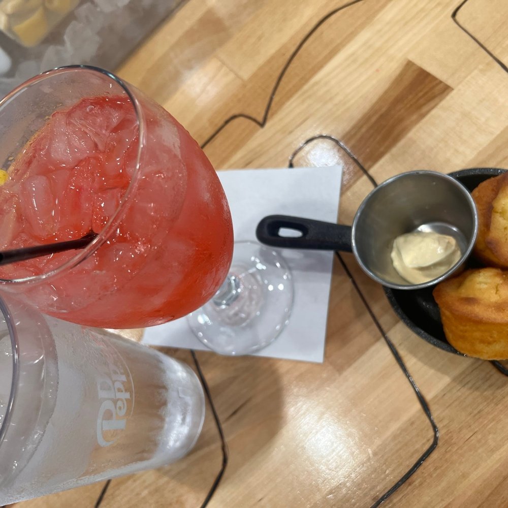 Southern Gourmet Kitchen - Signature drink and cornbread muffins with butter - Southern Near Me - Plano, Texas Southern Gourmet Kitchen - Signature drink and cornbread muffins with butter - Southern Near Me - Plano, Texas