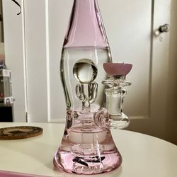 Big Al's Smoke And Gifts - Glass bubbler shaped like a lava lamp with pink accents and a percolator