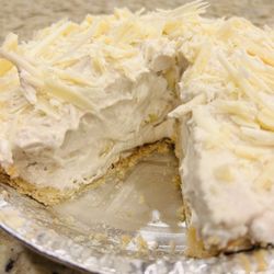 Mechelle's Baking Company - Banana Mousse Pie layered w/fresh bananas and topped with shaved white chocolate.