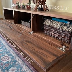 Custom Corners - Hidden storage entertainment center