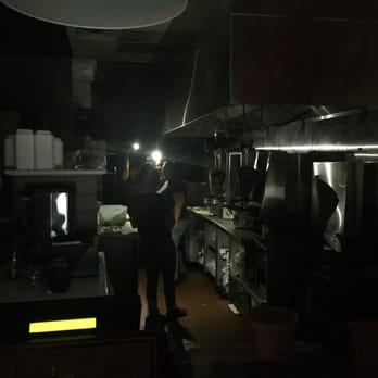 Mashawi Grill - Employees trying to cook during a blackout by using their cell phones. - Mediterranean Near Me - Redondo Beach, California