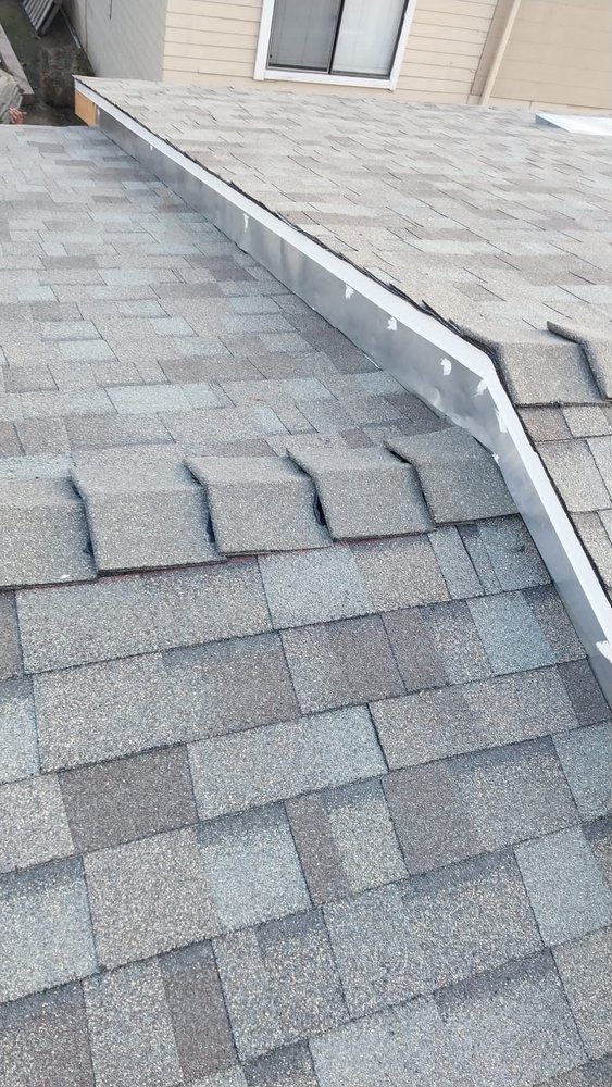 Slide of Tello's Roofing