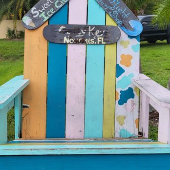 Sweet Melissa's Ice Cream - a colorful bench with a surfboard on it - Ice Cream & Frozen Yogurt Near Me - Nokomis, Florida Sweet Melissa's Ice Cream - a colorful bench with a surfboard on it - Ice Cream & Frozen Yogurt Near Me - Nokomis, Florida
