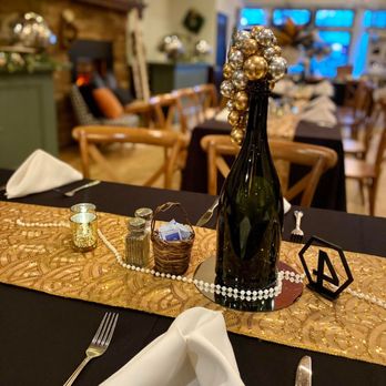 The Victorian Room - a table setting with a bottle of champagne - Caterers Near Me - Bay Shore, New York The Victorian Room - a table setting with a bottle of champagne - Caterers Near Me - Bay Shore, New York