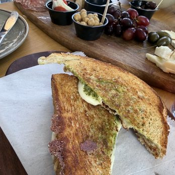 Faro - Grilled Cheese and Pesto Panini in front of the Faro Charcuterie Board - Pizza Near Me - Flagler Beach, Florida
