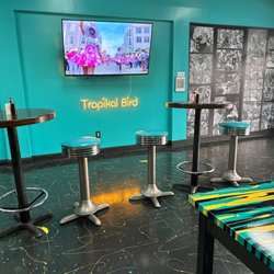 Tropikal Bird Turkey Legs - Carnival footage playing in the dining room
