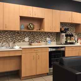 The service waiting room includes complimentary coffee, cold bottled water, and snacks. It also has very comfortable leather chairs. The service waiting room includes complimentary coffee, cold bottled water, and snacks. It also has very comfortable leather chairs.