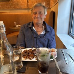 My husband enjoying his NY strip at the James My husband enjoying his NY strip at the James