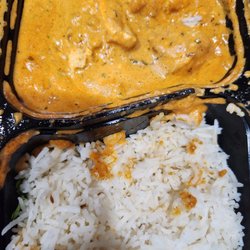 Taj Modern Indian Cuisine - Chicken Tikka masala. Was more bright yellow in person.