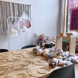 Indigo & Violet Studio - Indigo & violet studio setup for a yarn wall hanging project with brass rings and neutral yarn bundles