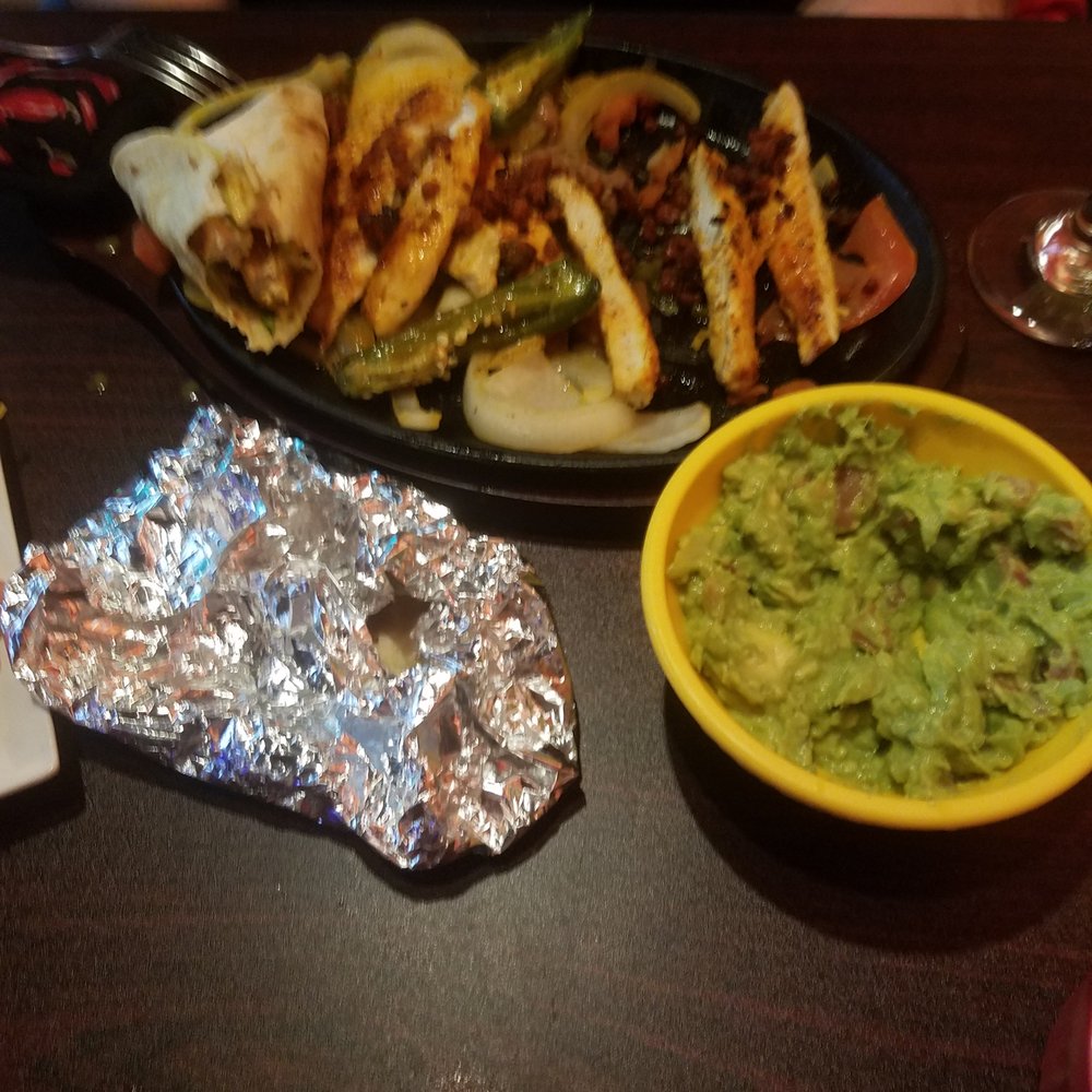 La Catrina Mexican Grill - a plate of chicken, guacamole, and chips - Mexican Near Me - Greenacres, Florida La Catrina Mexican Grill - a plate of chicken, guacamole, and chips - Mexican Near Me - Greenacres, Florida